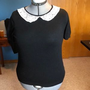 Black, lace-collared shirt